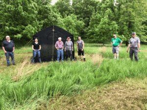 Linn County Ike's crew setting up monarch butterfly rearing tents