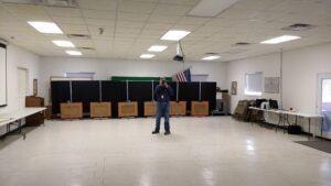 Range officer standing in the air rifle range facility at the 2021 Iowa State Championship