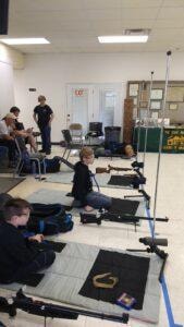 Young shooters in prone position at the 2021 Iowa State Air Rifle Championship